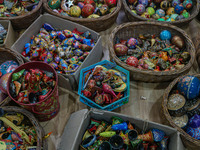 Christmas ornaments are ready at the workshop before being sent to the market ahead of Christmas celebrations in Srinagar, Jammu and Kashmir...