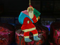 Christmas ornaments, including Santa Claus, are ready at the workshop before being sent to the market ahead of Christmas celebrations in Sri...