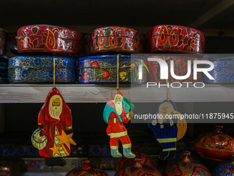 Christmas ornaments, including Santa Claus, are ready at the workshop before being sent to the market ahead of Christmas celebrations in Sri...