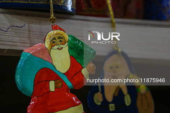 Christmas ornaments, including Santa Claus, are ready at the workshop before being sent to the market ahead of Christmas celebrations in Sri...