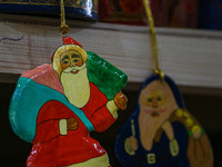 Christmas ornaments, including Santa Claus, are ready at the workshop before being sent to the market ahead of Christmas celebrations in Sri...