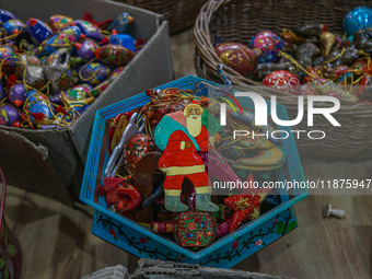 Christmas ornaments, including Santa Claus, are ready at the workshop before being sent to the market ahead of Christmas celebrations in Sri...