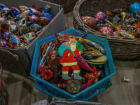 Christmas ornaments, including Santa Claus, are ready at the workshop before being sent to the market ahead of Christmas celebrations in Sri...