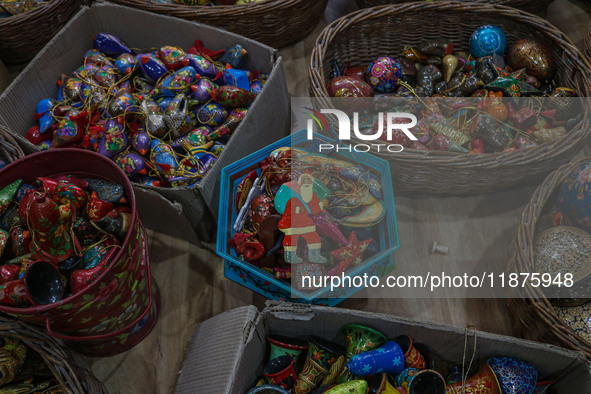 Christmas ornaments are ready at the workshop before being sent to the market ahead of Christmas celebrations in Srinagar, Jammu and Kashmir...