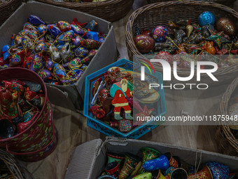 Christmas ornaments are ready at the workshop before being sent to the market ahead of Christmas celebrations in Srinagar, Jammu and Kashmir...