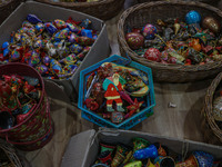 Christmas ornaments are ready at the workshop before being sent to the market ahead of Christmas celebrations in Srinagar, Jammu and Kashmir...