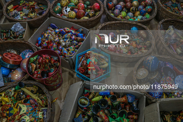 Christmas ornaments are ready at the workshop before being sent to the market ahead of Christmas celebrations in Srinagar, Jammu and Kashmir...