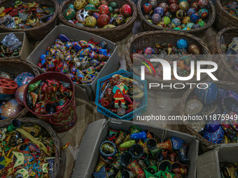 Christmas ornaments are ready at the workshop before being sent to the market ahead of Christmas celebrations in Srinagar, Jammu and Kashmir...