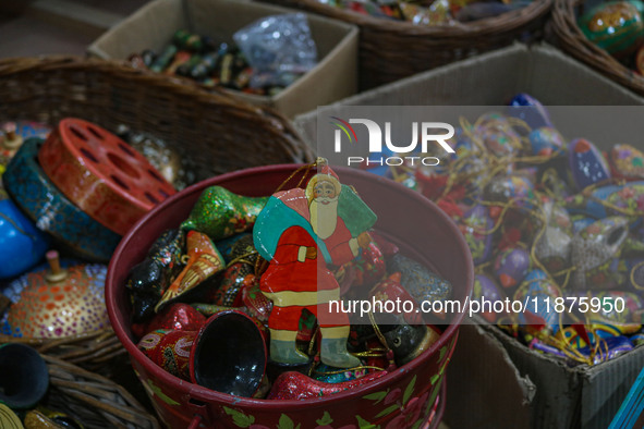 Christmas ornaments are ready at the workshop before being sent to the market ahead of Christmas celebrations in Srinagar, Jammu and Kashmir...