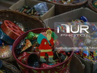 Christmas ornaments are ready at the workshop before being sent to the market ahead of Christmas celebrations in Srinagar, Jammu and Kashmir...