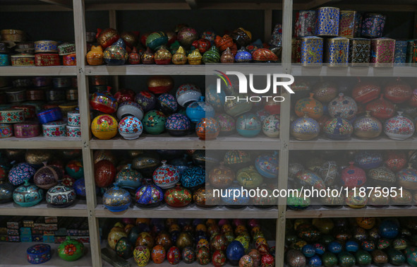 Christmas ornaments are ready at the workshop before being sent to the market ahead of Christmas celebrations in Srinagar, Jammu and Kashmir...