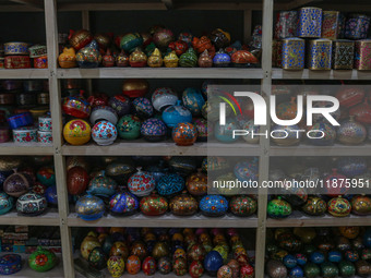 Christmas ornaments are ready at the workshop before being sent to the market ahead of Christmas celebrations in Srinagar, Jammu and Kashmir...