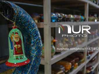 Christmas ornaments are ready at the workshop before being sent to the market ahead of Christmas celebrations in Srinagar, Jammu and Kashmir...