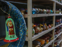 Christmas ornaments are ready at the workshop before being sent to the market ahead of Christmas celebrations in Srinagar, Jammu and Kashmir...