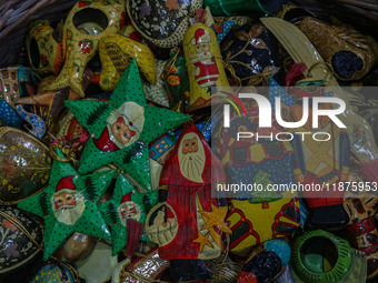 Christmas ornaments are ready at the workshop before being sent to the market ahead of Christmas celebrations in Srinagar, Jammu and Kashmir...