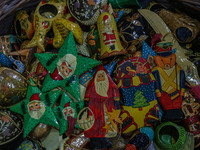 Christmas ornaments are ready at the workshop before being sent to the market ahead of Christmas celebrations in Srinagar, Jammu and Kashmir...