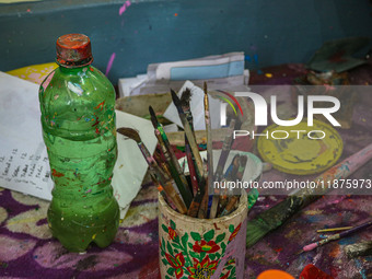 Brushes and colors used in papier-mache decoration are seen at the workshop in Srinagar, Jammu and Kashmir, on December 17, 2024. Artisans i...