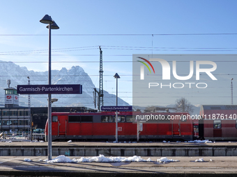 A Deutsche Bahn regional train is at the station in Garmisch-Partenkirchen, Bavaria, Germany, on December 13, 2024. (