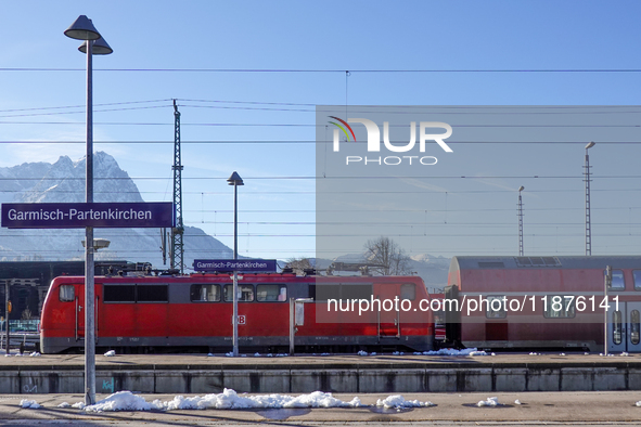 A Deutsche Bahn regional train is at the station in Garmisch-Partenkirchen, Bavaria, Germany, on December 13, 2024. 