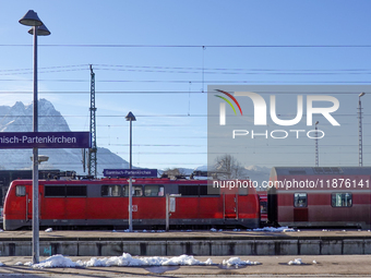 A Deutsche Bahn regional train is at the station in Garmisch-Partenkirchen, Bavaria, Germany, on December 13, 2024. (