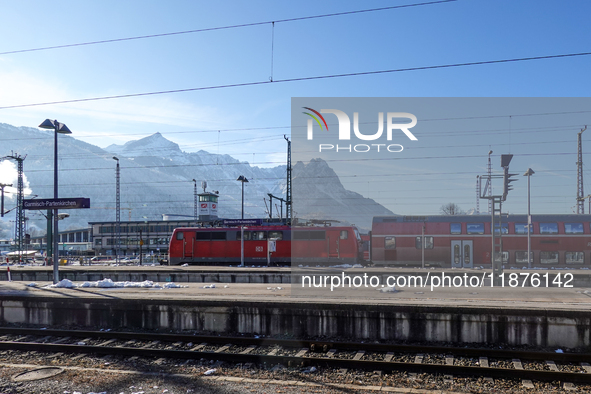 A Deutsche Bahn regional train is at the station in Garmisch-Partenkirchen, Bavaria, Germany, on December 13, 2024. 