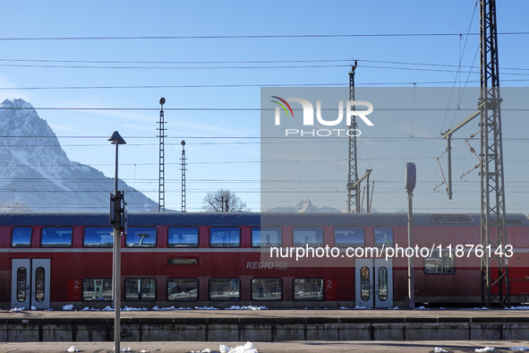 A Deutsche Bahn regional train is at the station in Garmisch-Partenkirchen, Bavaria, Germany, on December 13, 2024. 