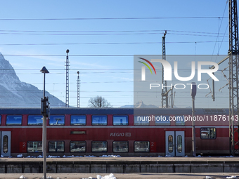 A Deutsche Bahn regional train is at the station in Garmisch-Partenkirchen, Bavaria, Germany, on December 13, 2024. (