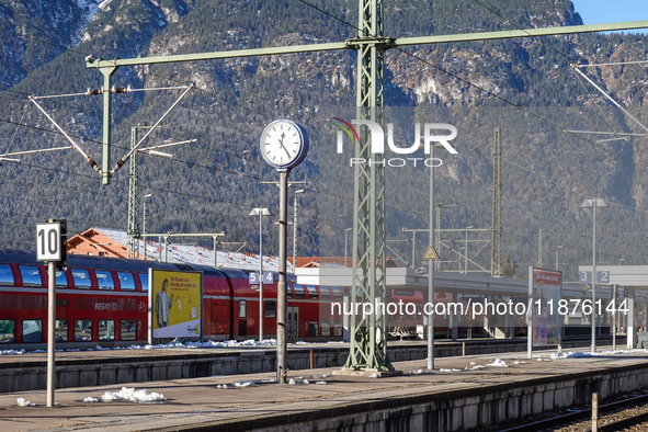 A Deutsche Bahn regional train is at the station in Garmisch-Partenkirchen, Bavaria, Germany, on December 13, 2024. 