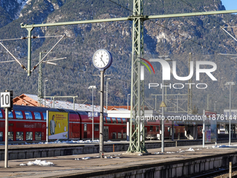 A Deutsche Bahn regional train is at the station in Garmisch-Partenkirchen, Bavaria, Germany, on December 13, 2024. (