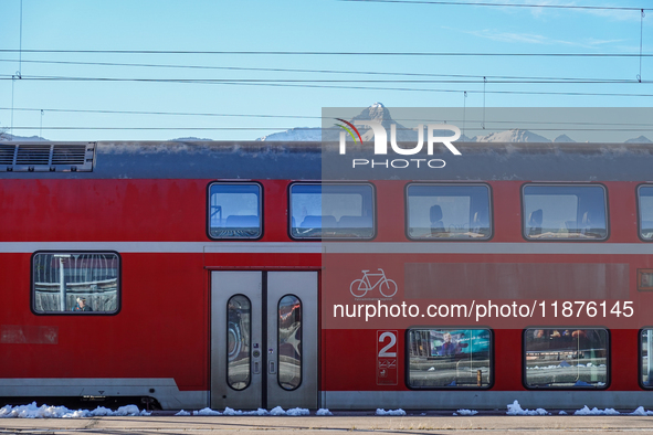 A Deutsche Bahn regional train is at the station in Garmisch-Partenkirchen, Bavaria, Germany, on December 13, 2024. 