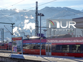 A Deutsche Bahn regional train is at the station in Garmisch-Partenkirchen, Bavaria, Germany, on December 13, 2024. (