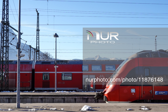 A Deutsche Bahn regional train is at the station in Garmisch-Partenkirchen, Bavaria, Germany, on December 13, 2024. 