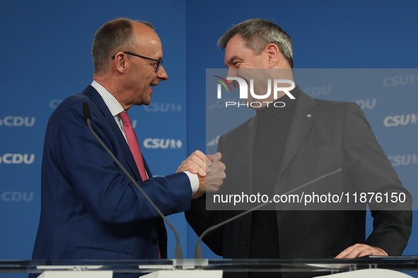 Friedrich Merz, CDU Federal Chairman and CDU/CSU Parliamentary Group Leader, and Markus Soder, the Prime Minister of Bavaria (CSU), speak to...