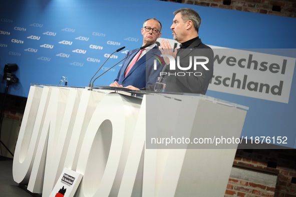 Friedrich Merz, CDU Federal Chairman and CDU/CSU Parliamentary Group Leader, and Markus Soder, the Prime Minister of Bavaria (CSU), speak to...