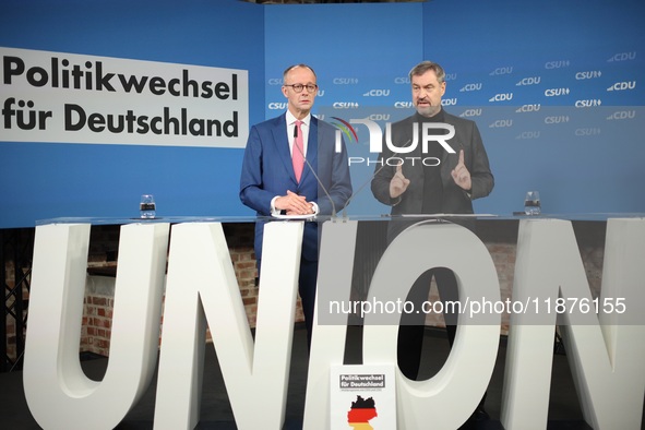 Friedrich Merz, CDU Federal Chairman and CDU/CSU Parliamentary Group Leader, and Markus Soder, the Prime Minister of Bavaria (CSU), speak to...