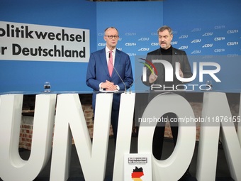 Friedrich Merz, CDU Federal Chairman and CDU/CSU Parliamentary Group Leader, and Markus Soder, the Prime Minister of Bavaria (CSU), speak to...