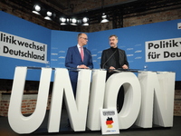 Friedrich Merz, CDU Federal Chairman and CDU/CSU Parliamentary Group Leader, and Markus Soder, the Prime Minister of Bavaria (CSU), speak to...