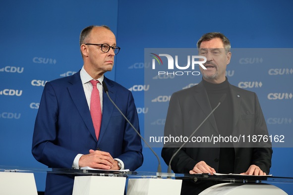 Friedrich Merz, CDU Federal Chairman and CDU/CSU Parliamentary Group Leader, and Markus Soder, the Prime Minister of Bavaria (CSU), speak to...