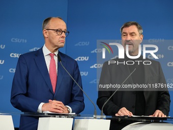 Friedrich Merz, CDU Federal Chairman and CDU/CSU Parliamentary Group Leader, and Markus Soder, the Prime Minister of Bavaria (CSU), speak to...