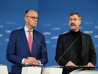 Friedrich Merz, CDU Federal Chairman and CDU/CSU Parliamentary Group Leader, and Markus Soder, the Prime Minister of Bavaria (CSU), speak to...