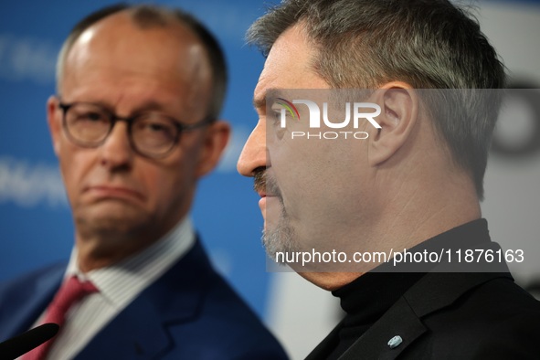 Friedrich Merz, CDU Federal Chairman and CDU/CSU Parliamentary Group Leader, and Markus Soder, the Prime Minister of Bavaria (CSU), speak to...