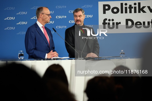 Friedrich Merz, CDU Federal Chairman and CDU/CSU Parliamentary Group Leader, and Markus Soder, the Prime Minister of Bavaria (CSU), speak to...