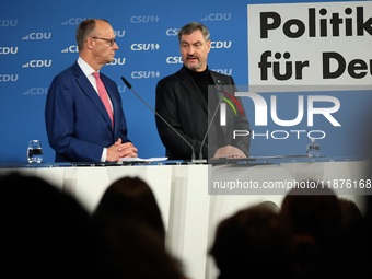 Friedrich Merz, CDU Federal Chairman and CDU/CSU Parliamentary Group Leader, and Markus Soder, the Prime Minister of Bavaria (CSU), speak to...