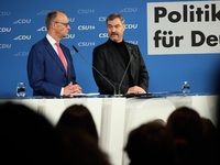 Friedrich Merz, CDU Federal Chairman and CDU/CSU Parliamentary Group Leader, and Markus Soder, the Prime Minister of Bavaria (CSU), speak to...