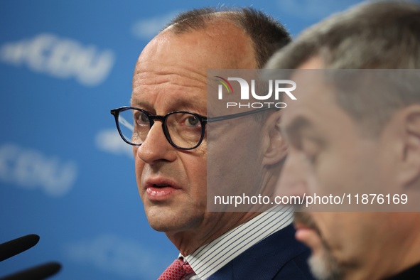 Friedrich Merz, CDU Federal Chairman and CDU/CSU Parliamentary Group Leader, and Markus Soder, the Prime Minister of Bavaria (CSU), speak to...