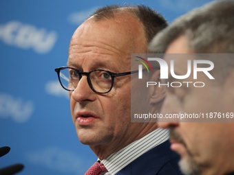 Friedrich Merz, CDU Federal Chairman and CDU/CSU Parliamentary Group Leader, and Markus Soder, the Prime Minister of Bavaria (CSU), speak to...