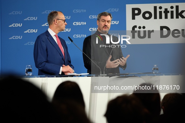 Friedrich Merz, CDU Federal Chairman and CDU/CSU Parliamentary Group Leader, and Markus Soder, the Prime Minister of Bavaria (CSU), speak to...