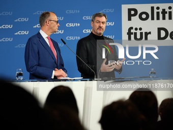 Friedrich Merz, CDU Federal Chairman and CDU/CSU Parliamentary Group Leader, and Markus Soder, the Prime Minister of Bavaria (CSU), speak to...