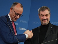 Friedrich Merz, CDU Federal Chairman and CDU/CSU Parliamentary Group Leader, and Markus Soder, the Prime Minister of Bavaria (CSU), speak to...