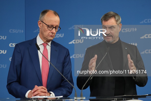 Friedrich Merz, CDU Federal Chairman and CDU/CSU Parliamentary Group Leader, and Markus Soder, the Prime Minister of Bavaria (CSU), speak to...